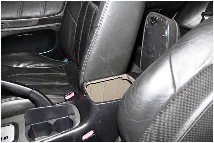 Drugs found under the hidden compartment of the centre armrest console