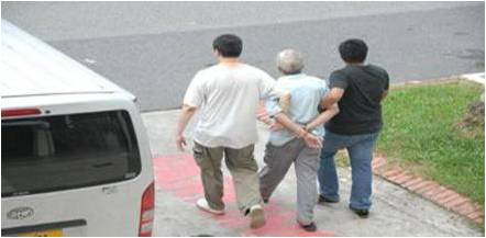 CNB officers arresting a drug suspect on 30 May 2013