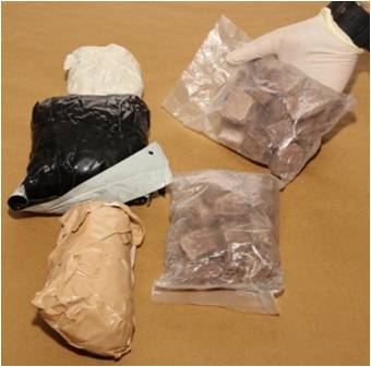 The black bundles of heroin recovered at Tuas Checkpoint on 3 Jan 13