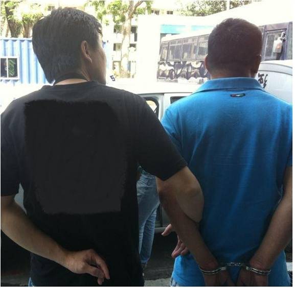 Suspects being arrested by CNB officers in operation 28-31 Jan 2013
