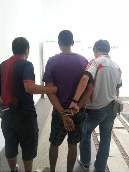 Suspects being arrested by CNB officers in operation 4-6 March 2013