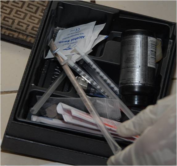 Photo 3: A box containing drugs and drug paraphernalia were among some items seized from one of the operations.