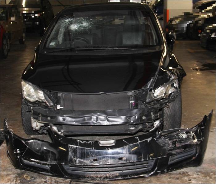 The damaged vehicle that the suspect used to evade arrest