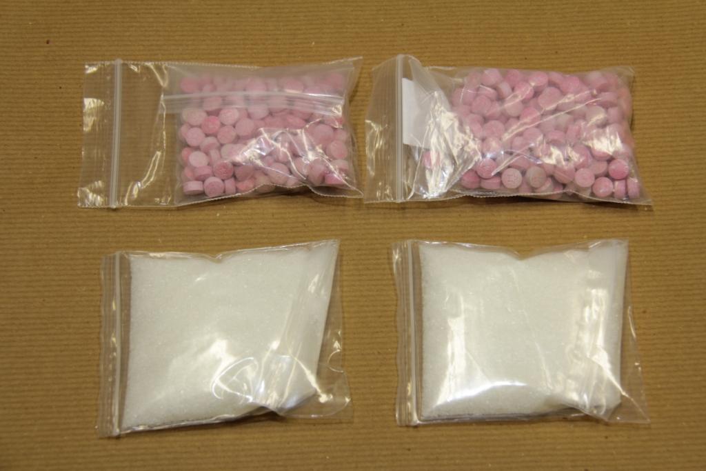 close up view of ecstasy tablets and ketamine