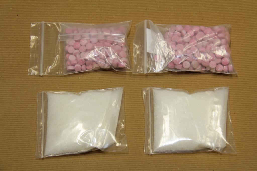 close up view of ecstasy tablets and ketamine close up view of ecstasy tablets and ketamine
