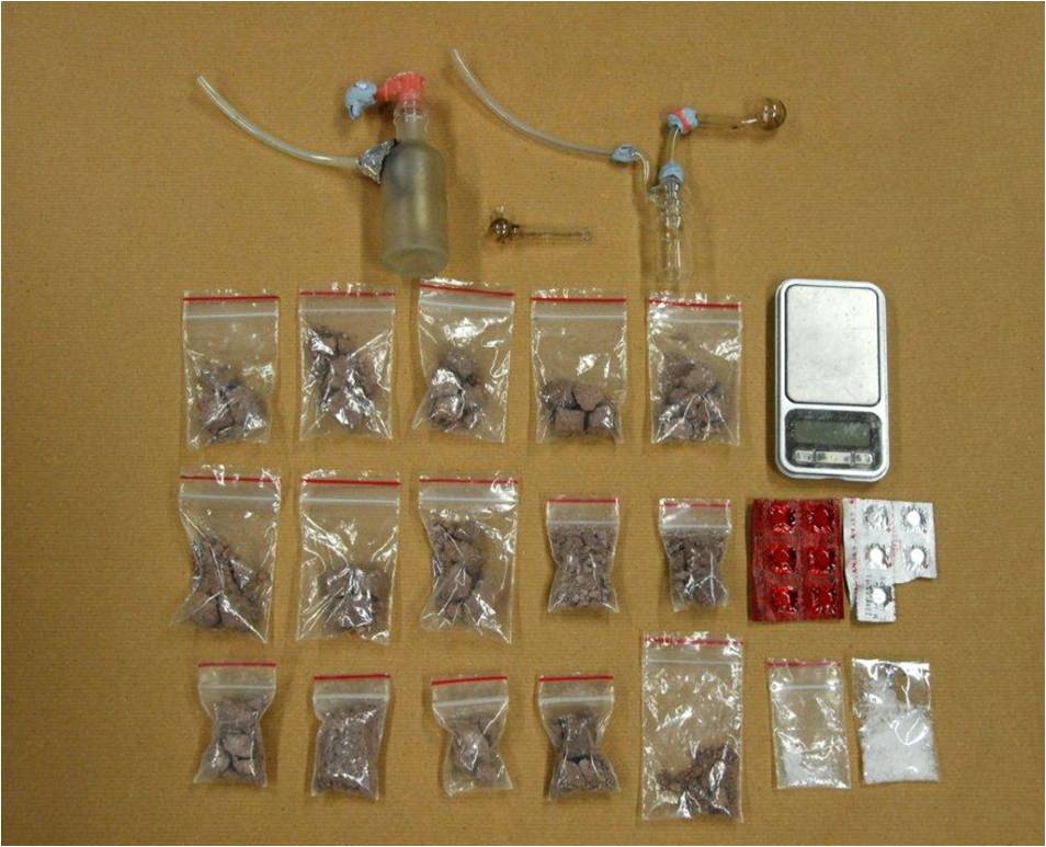 Photo 1: Drugs and drug smoking apparatus seized in a CNB operation on 13 March 2014.