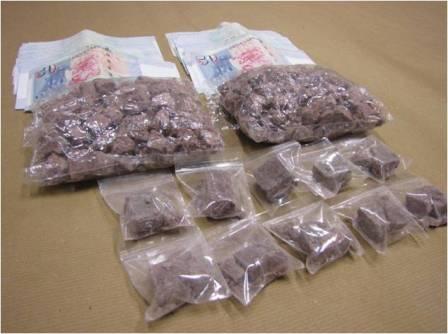 Heroin and cash seized in CNB operation on 10 March 2014.