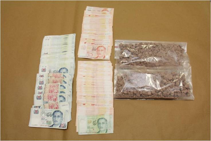 Heroin and cash seized in CNB operation on 19 March 2014.