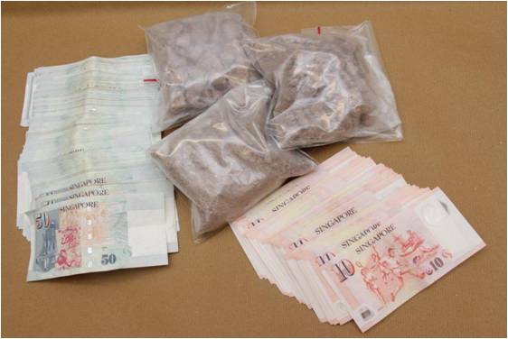 Heroin and cash seized in a CNB operation at Paya Lebar on 12 Feb 2014.