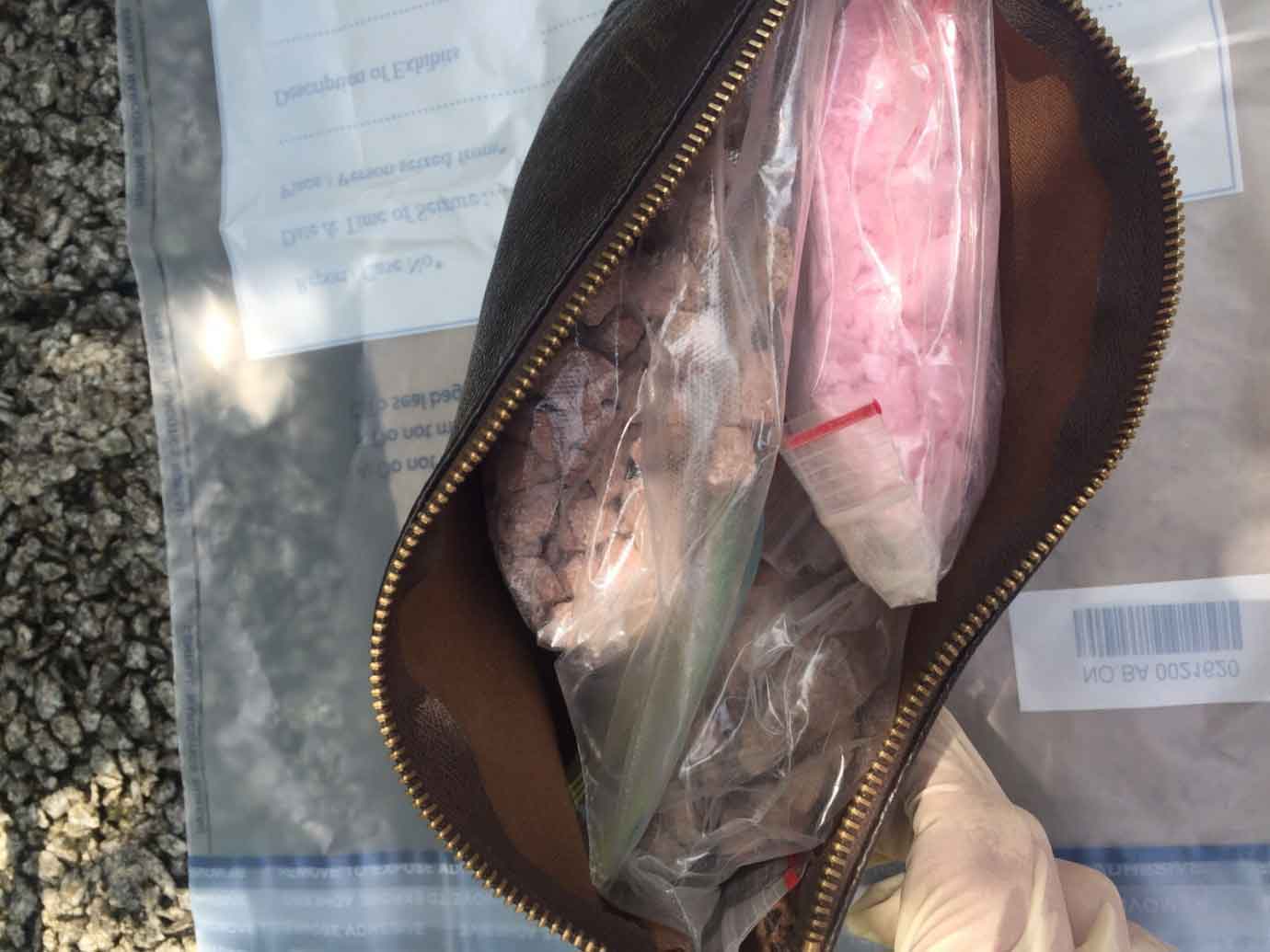 Photo-3: Drugs within a pouch recovered from ledge outside a unit, in CNB operation at Orange Grove on 29 Oct 2015