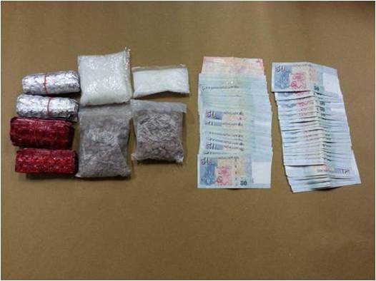 Photo 2: Drugs and cash seized in a CNB operation on 30 October 2014