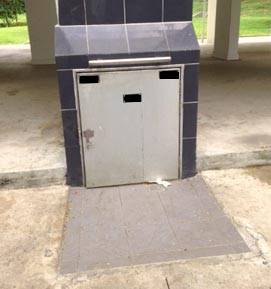 Photo 1: Rubbish chute where two bundles of cannabis were found Photo 1: Rubbish chute where two bundles of cannabis were found