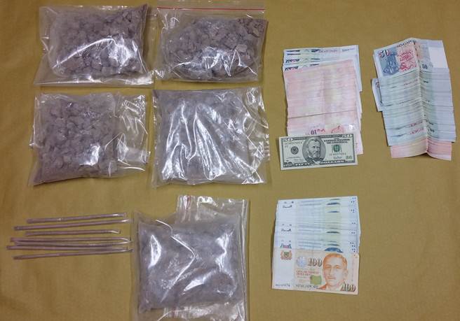 Photo 1: Heroin and cash seized during a CNB operation on 27 July 2016.