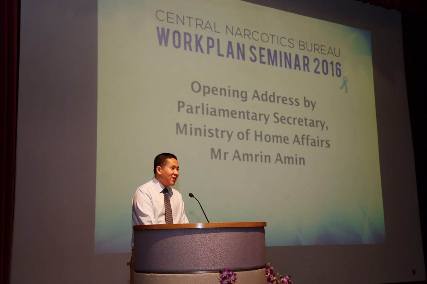 Parliamentary Secretary, Ministry of Home Affairs, Mr Amrin Amin, giving the opening address at CNB's Workplan Seminar 2016.