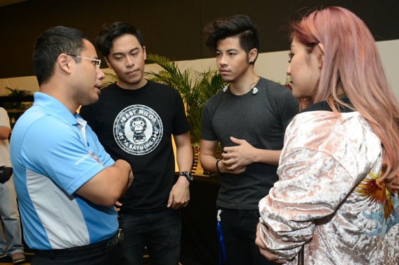 Photo 1: Second Minister for Home Affairs and National Development, Mr Desmond Lee, interacting with members of The Sam Willows.