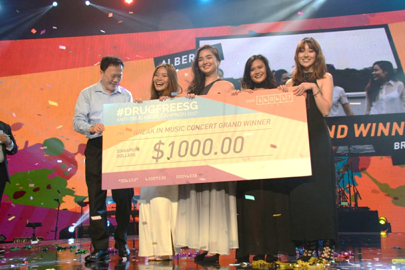 Photo 2: Local all-female quartet, Alberose, receiving their prize money of $1,000 from Dr Chew Tuan Chiong, Vice Chairman of NCADA.