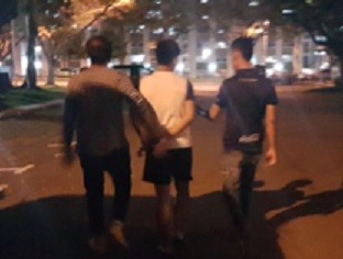 Photo-2: CNB officers escorting an arrested drug suspect during CNB’s island-wide operation from 30 March to 6 April 2018