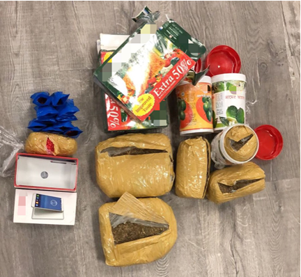 Photo-1 (CNB): Cannabis and ‘Yaba’ tablets found concealed within canisters and boxes labelled as containing food items, recovered from a male foreign national on 9 July 2018.