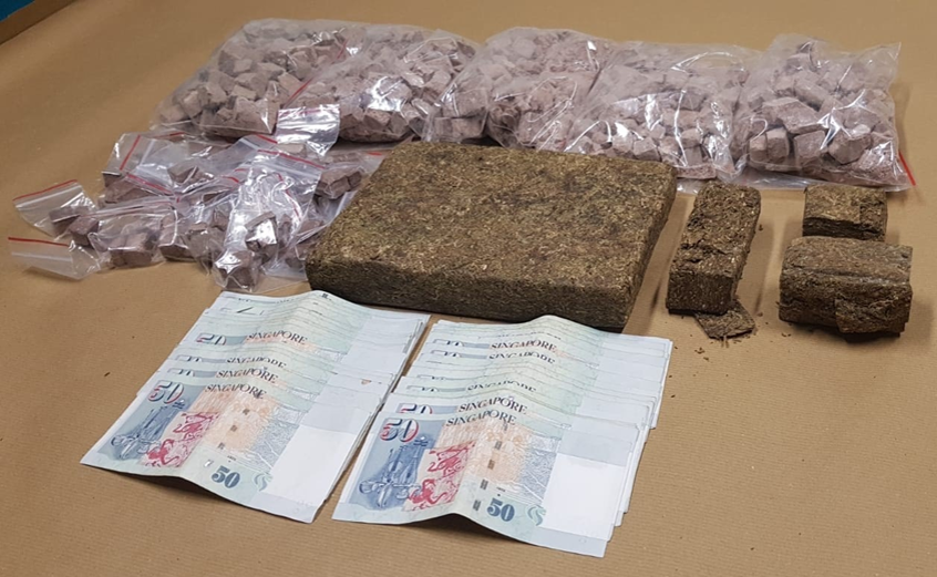 Photo-3 (CNB): Heroin, cannabis and cash seized in CNB operation on 13 June 2018.