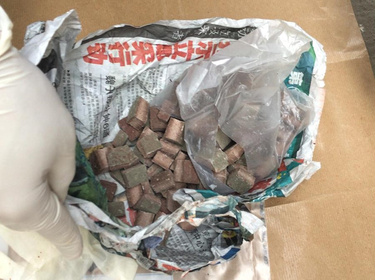 Photo-4 (CNB): Close-up view of heroin, which was in plastic bag thrown down rubbish chute, in CNB operation on 17 September 2018.