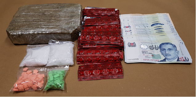 Photo-1 (CNB): Cannabis, ‘Ice’, ‘Ecstasy’ tablets, Erimin-5 tablets and cash seized in CNB operation on 23 May 2018.