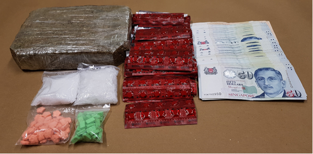 Photo-1 (CNB): Cannabis, ‘Ice’, ‘Ecstasy’ tablets, Erimin-5 tablets and cash seized in CNB operation on 23 May 2018. Photo-1 (CNB): Cannabis, ‘Ice’, ‘Ecstasy’ tablets, Erimin-5 tablets and cash seized in CNB operation on 23 May 2018.