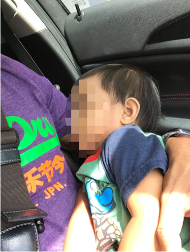 Photo-3: The one-year old toddler safely secured and sleeping prior to CNB officers handing him over to the care of the Child Protective Service of the Ministry of Social and Family Development