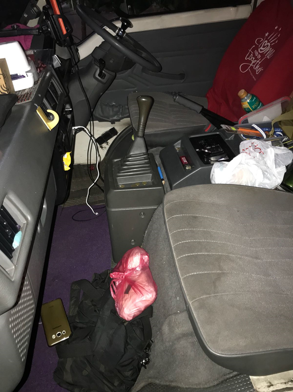 Photo-2 (CNB): Photo of interior of van.  Heroin packed in two bundles and placed inside a red plastic bag, were recovered from within the van, in CNB operation on 25 June 2018.