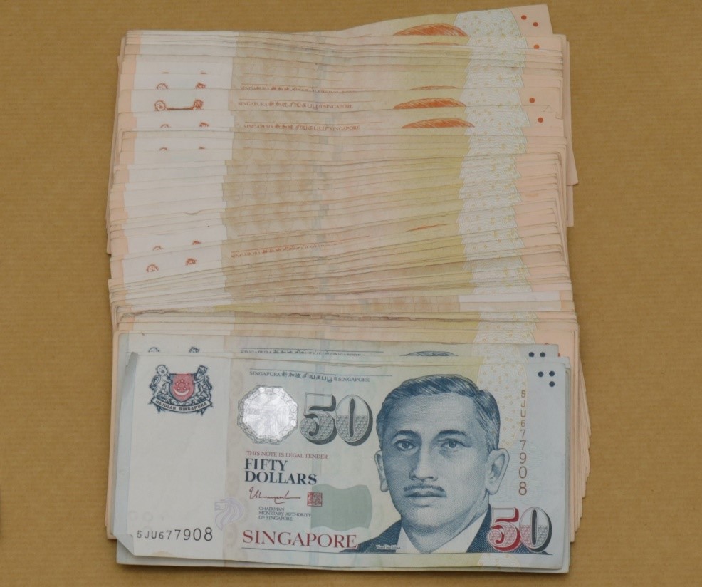 Cash seized from CNB operation at Woodlands Street 13 on 11 Dec 2019 Cash seized from CNB operation at Woodlands Street 13 on 11 Dec 2019