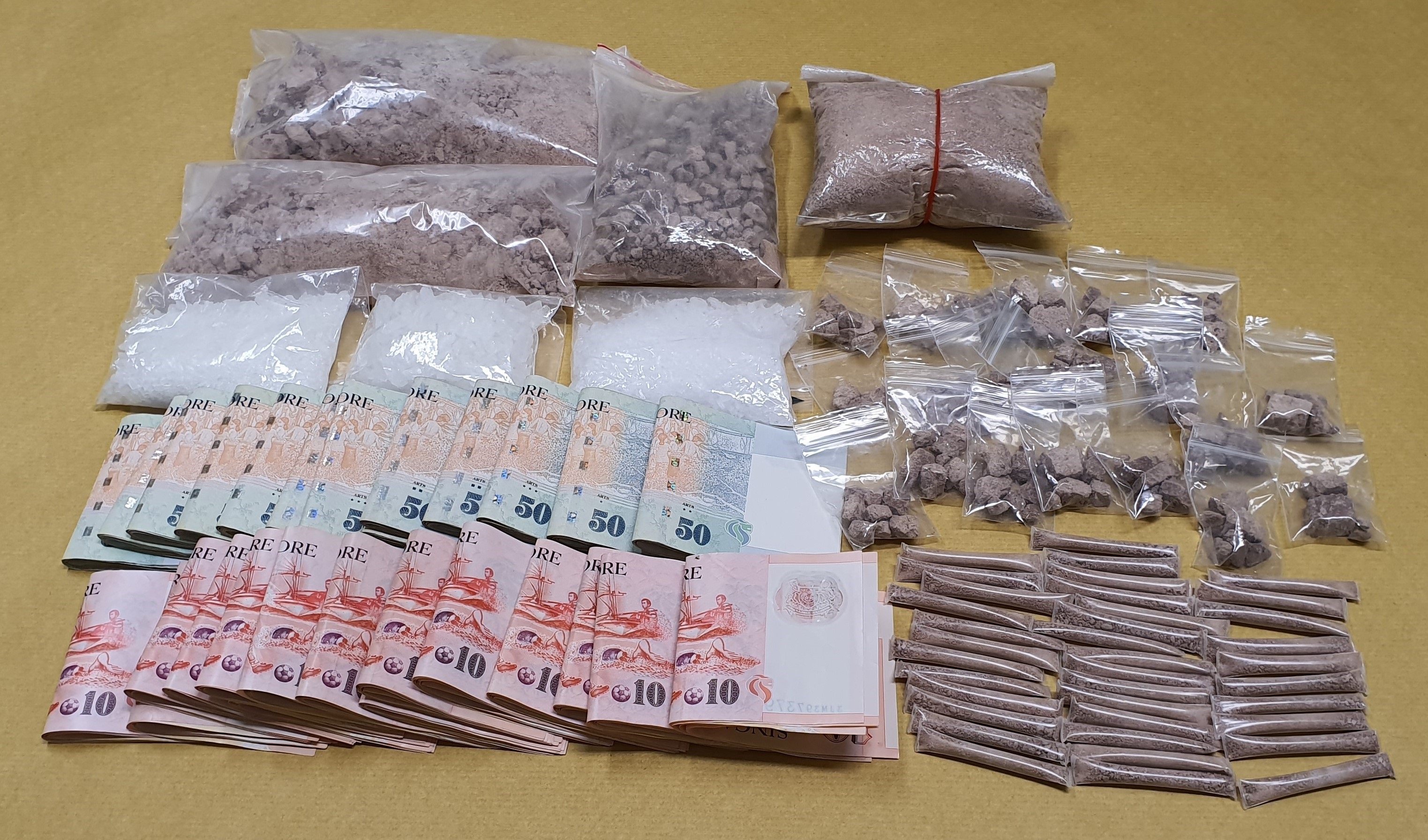 Photo-1 (CNB):  Drugs and cash seized from 54-year-old suspected drug trafficker and from within his residential unit, during CNB island-wide operation from 23 to morning of 27 September 2019.