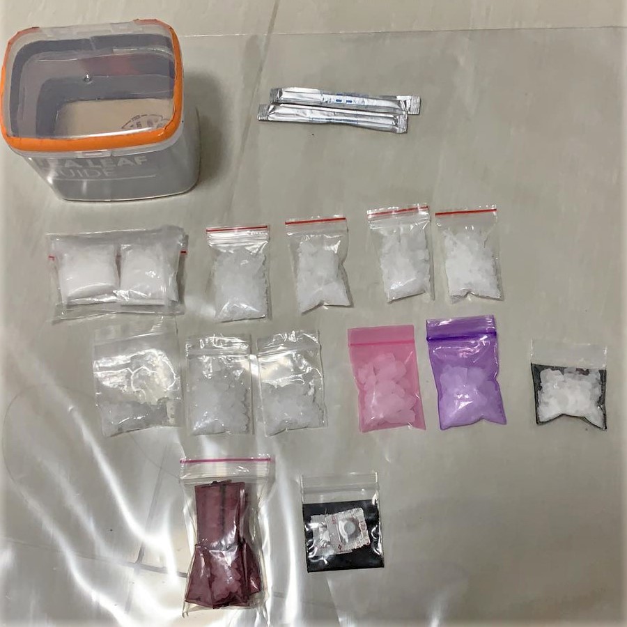 Photo 2- Packets of ‘Ice’ and ‘Ecstasy’ tablets seized in the vicinity Buangkok Crescent during CNB’s operation on 15 July 2020